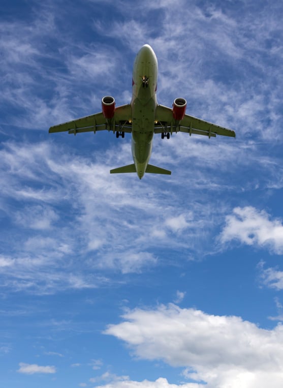 Plane flying overhead on a sunny day