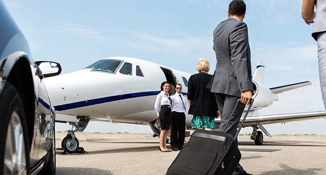 Business person about to board a private jet